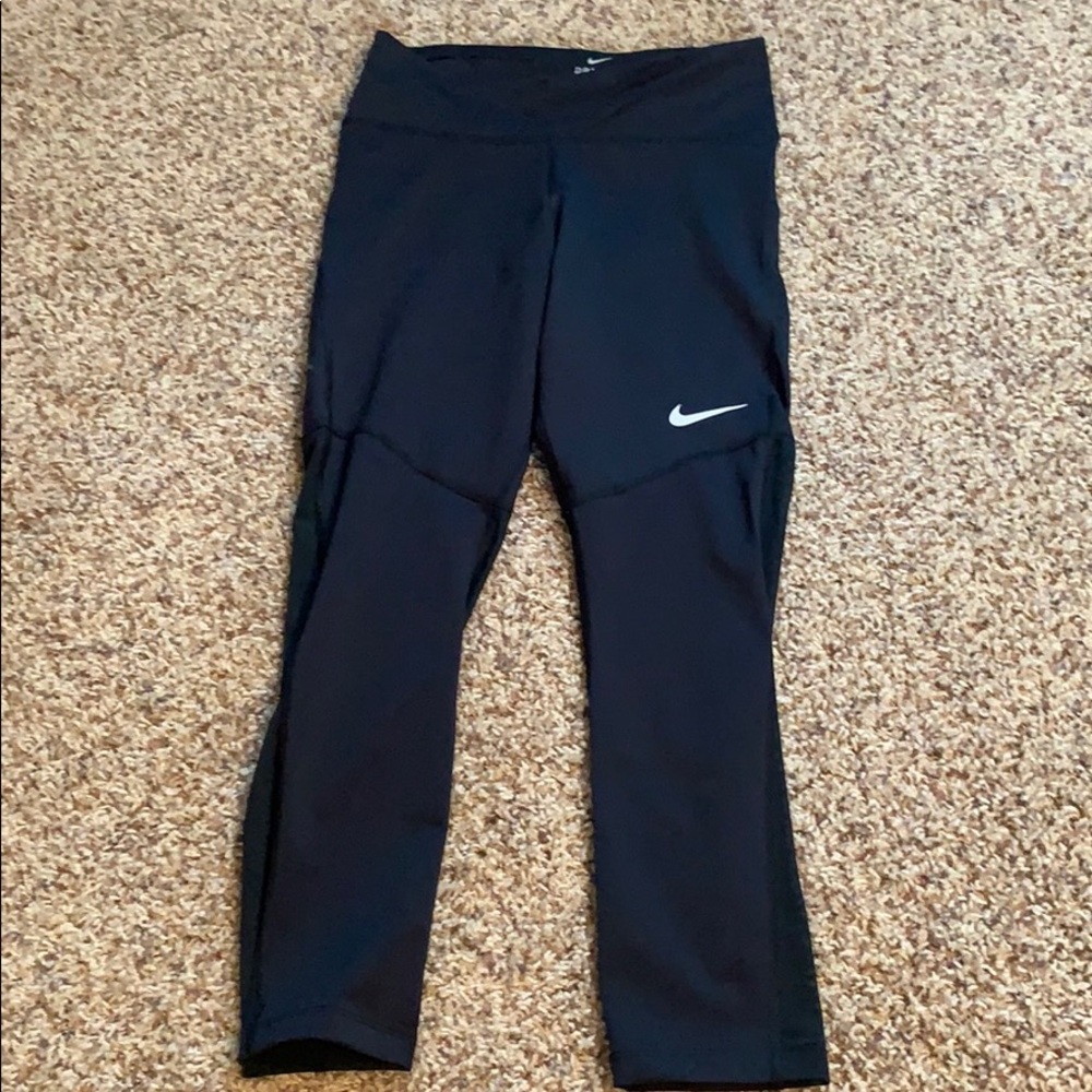 New black Nike workout leggings with mesh back